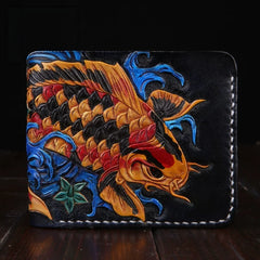 Black leather bifold wallet with gold koi and blue wave carving, front view