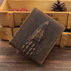 Dragon embossed leather billfold wallet with 3D dragon claw relief, standing by wooden crate