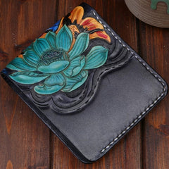 Back of carved leather billfold wallet with teal lotus flower tooling