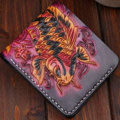 Hand painted red and gold koi leather wallet on wooden table