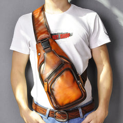 Tan leather chest bag worn on male model, crossbody carry