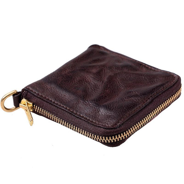 Coffee textured leather zip-around billfold wallet with brass ring pull, studio shot