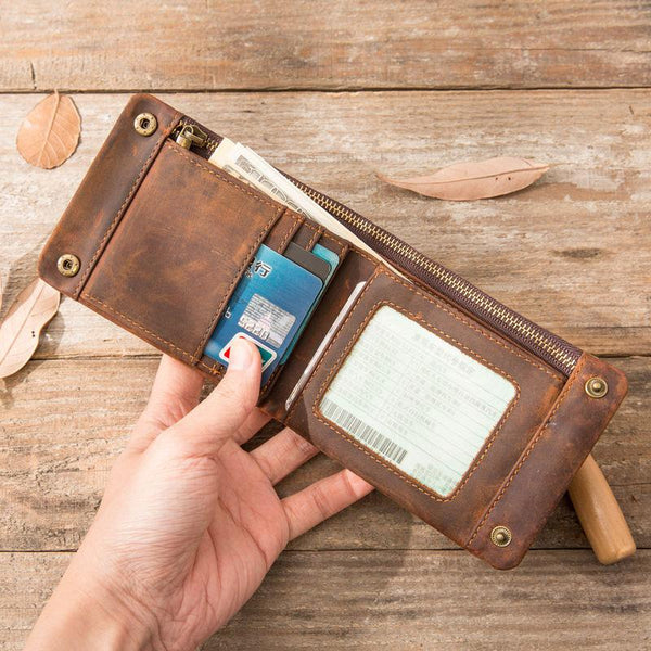 Front of slim vintage full-grain leather bifold wallet with brass snaps
