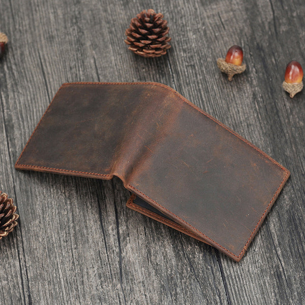 Coffee brown leather bifold wallet partially open showing interior leather panels