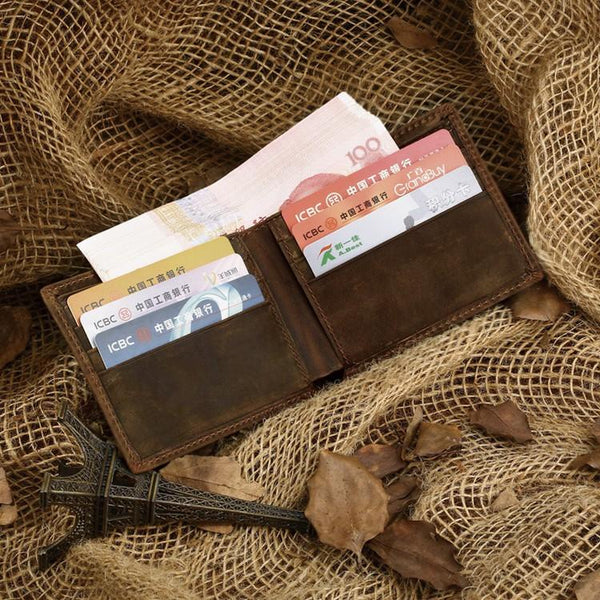 Short vintage leather bifold wallet front on burlap fabric