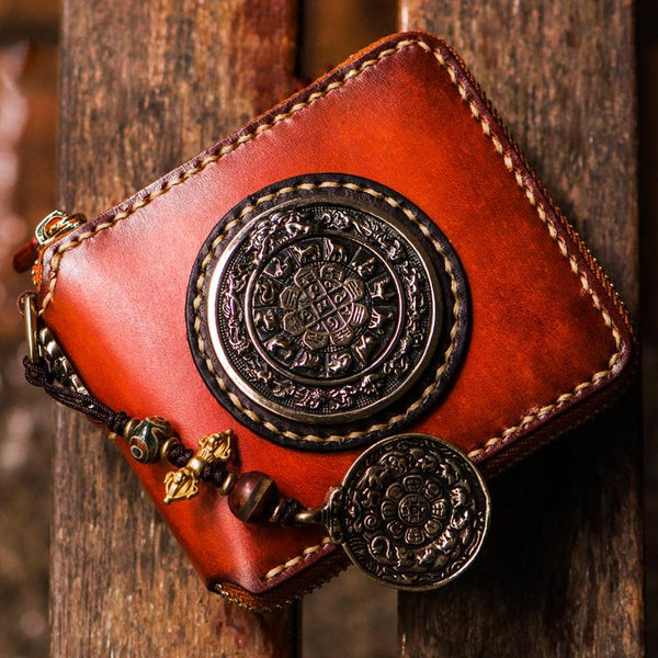 Hand tooled Tibetan style leather billfold wallet with ornate carving and metal pendant